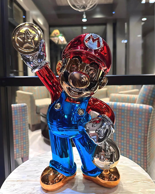 Super Mario gold and blue chrome pop art sculpture holding a money coin, displayed on a marble table. 